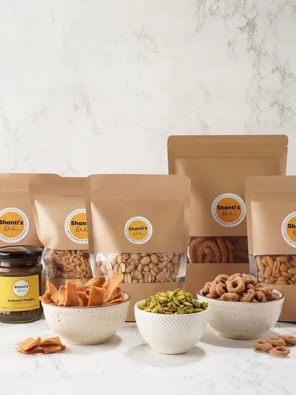 Here is a glimpse of the full range of snacks I offer. Each pouch is sealed for freshness, from my crunchy hing jeera peanuts and corn mixture to classic murukkus and a jar of my tangy thokku.