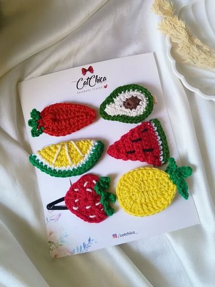 A full set of our crochet fruit clips! This one includes a strawberry, avocado, lemon, watermelon, and pineapple. So fun for summer!