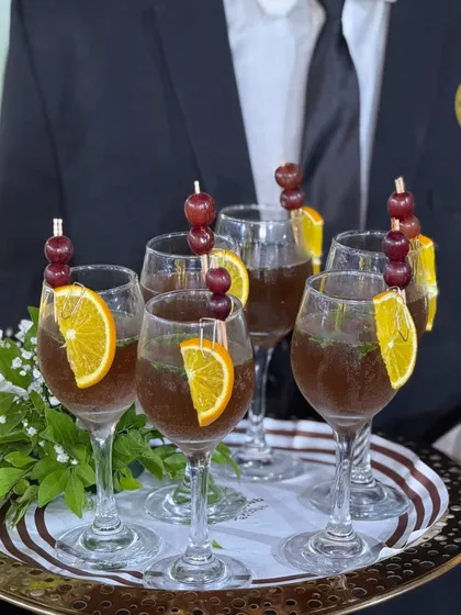 Our elegantly garnished mocktails, served on a silver tray. We believe in providing a premium beverage service that matches the quality of our food.