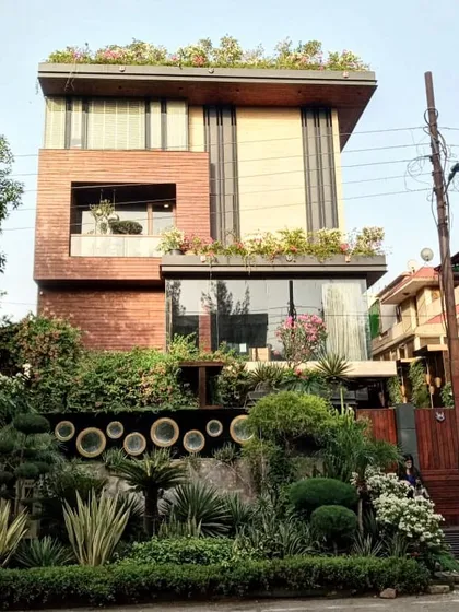 A wide shot of the C-23 residence in Noida, showcasing the complete vision where the architecture and the multi-layered landscape design become one.