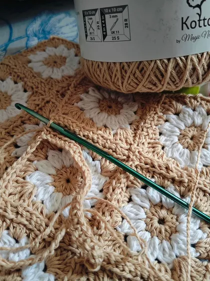 Something exciting is on the way. Working on a new piece with this lovely beige cotton yarn, creating daisy granny squares for a regular customer.