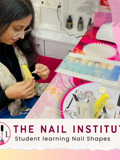 This student is learning about different nail shapes by practicing on a set of nail tips, a key part of our foundation course.