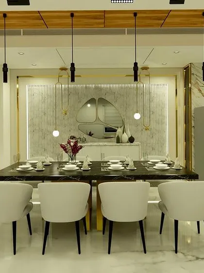 A frontal view of the dining table, looking towards the open kitchen and a beautifully lit crockery unit.