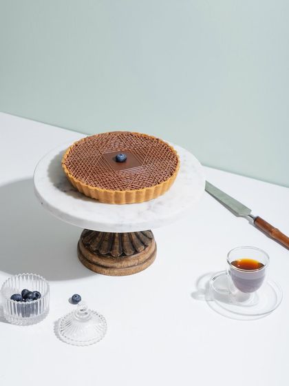 Have you had a chance to try our delicious tarts yet? This one features a rich chocolate filling with an intricate lattice top.