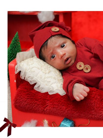 A beautiful portrait of the awake newborn. His wide eyes are full of wonder.