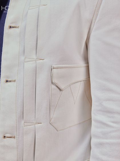 White done right. This close-up shows the structured pocket and pleat details of my premium white shacket, a piece that is sleek, structured, and undeniably premium.