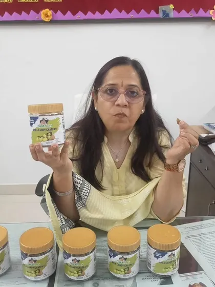 This customer is surrounded by jars of our Amla Candy, ready to share the goodness. It shows the trust people have in our homemade quality.