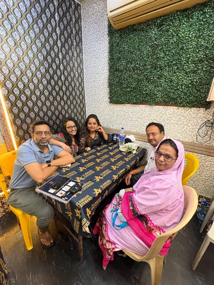 Happy faces enjoying a meal together. Our custom table covers from Urban Mix add a special touch to the dining experience.