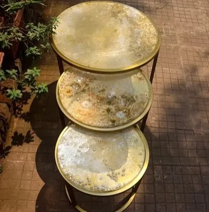A set of three nesting tables I revamped with a unique, textured gold and white resin finish. This is one of my favorite upcycling projects from over the years.