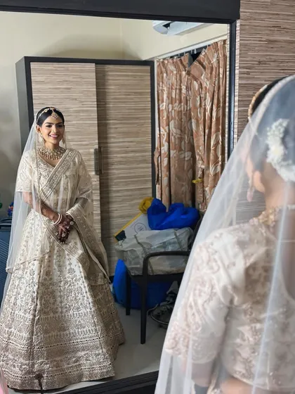 A vision in white. This bride wanted an elegant and serene look for her wedding day. We chose a soft, luminous makeup style and a classic floral bun to create a look of pure grace.