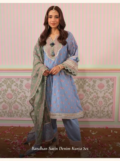 The Bandhan Satin Denim Kurta Set is a more festive take on denim. The satin finish and intricate embroidery make it a unique choice for special occasions.
