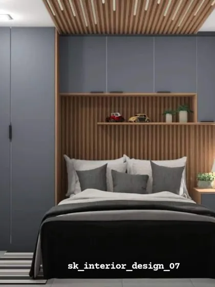 A modern bedroom with a masculine feel, featuring grey wardrobes and a wood-slatted headboard and ceiling detail. The design is clean, textured, and sophisticated.