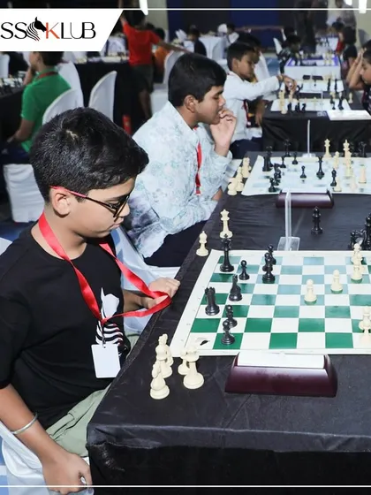 A young player wearing his event lanyard, focused on his next move during a tournament we hosted with KSCA and BUDCA. These collaborations offer great exposure for our students.