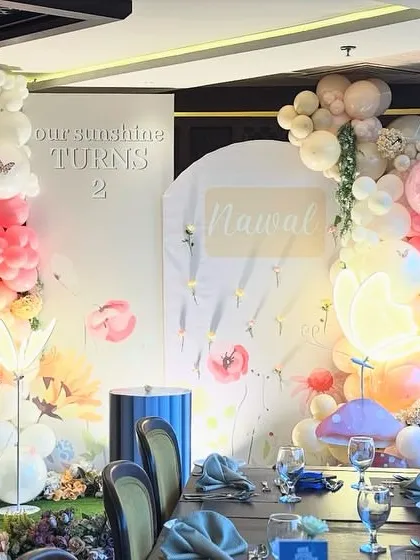 The butterfly garden theme viewed from the dining table, showing how our decor creates a complete and immersive celebratory atmosphere.