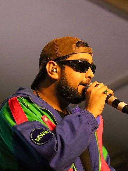 A close-up of Shashwat Singh, known for hits like 'Kesariya' and 'Haan Main Galat', during his live performance.