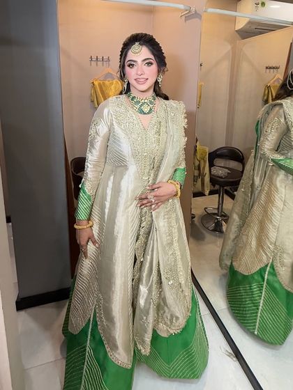 A full view of this beautiful Lohri outfit. The green and gold suit is so elegant, and the makeup was designed to match its regal feel.