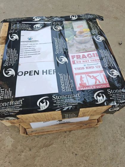 A small rainbow sandstone sphere fountain, sold and dispatched to Mumbai. The final crate is sealed and ready to go.