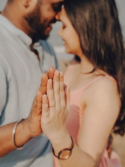 A detail shot focusing on the couple's hands and her engagement ring. These small details add a beautiful layer to the story of your pre-wedding session.