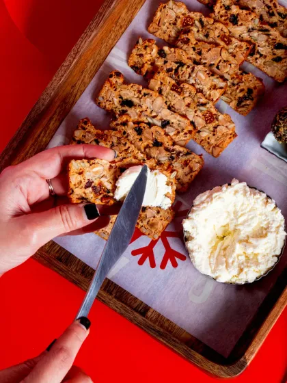 Our Fruit 'N' Nut Crisps are perfect for a festive cheese board. These golden, buttery crisps are packed with almonds, pecans, seeds, and dried fruit.