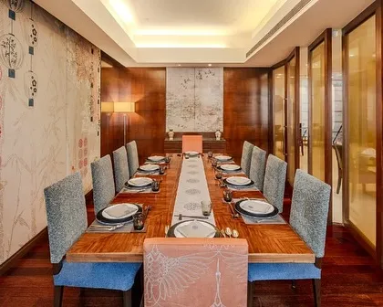The private dining area at Tamari, a Southeast Asian restaurant at a Taj property. I used a more intimate palette of blue and orange, with bird motifs and custom wallpaper to create a contemplative environment for private gatherings.