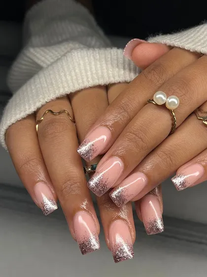 A glamorous take on the French manicure for square nails. This is a glitter fade using a beautiful rose gold glitter for a warm, sparkling finish.