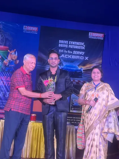 Receiving a bouquet as a token of appreciation after a successful show for Servo.