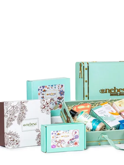 My custom gift boxes come in all shapes and sizes. This image showcases a variety of my packaging options, from elegant trunk boxes to smaller, beautifully printed cartons, all designed to make your gift feel extra special.