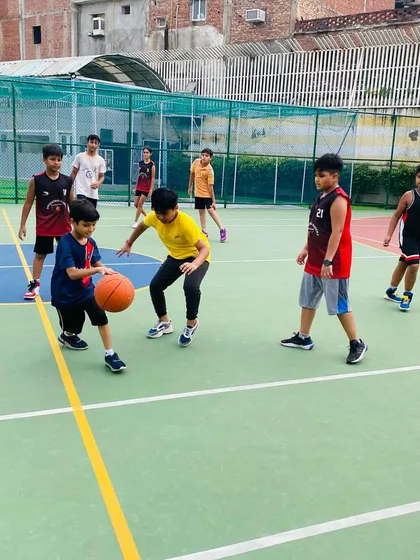 A young player practices dribbling.
