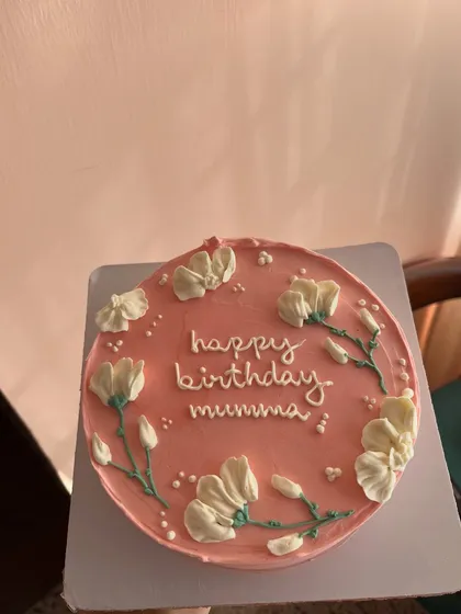 A lovely pink bento cake for a "mumma's" birthday, decorated with simple, elegant piped flowers and stems.