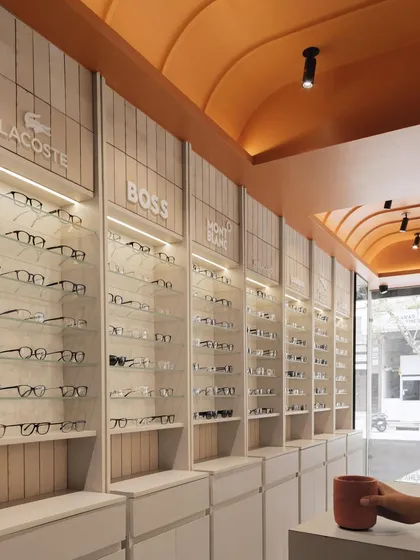 For 'The Brick Vault' retail project, we designed a striking terracotta vaulted ceiling that creates a warm, inviting atmosphere. This architectural feature, combined with clean, minimalist display units, establishes a unique and memorable brand experience for customers.