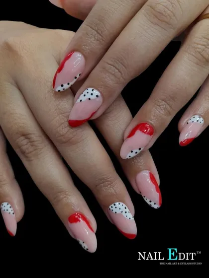 A playful abstract design using a combination of red shapes and black polka dots over a sheer pink base. This fun, mismatched pattern is perfect for a creative and unique style.