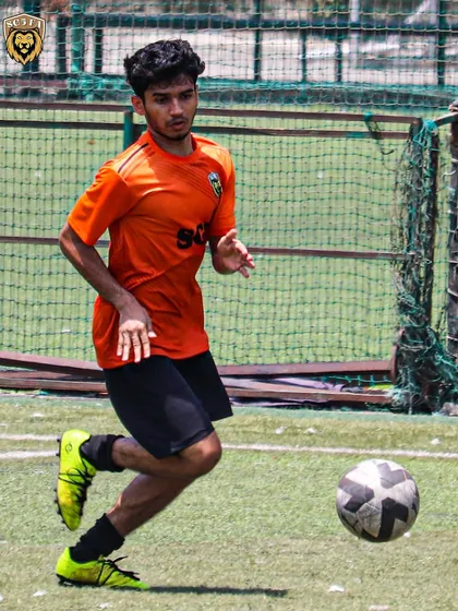 A player focused on the ball, ready to make a decisive play in the final third.