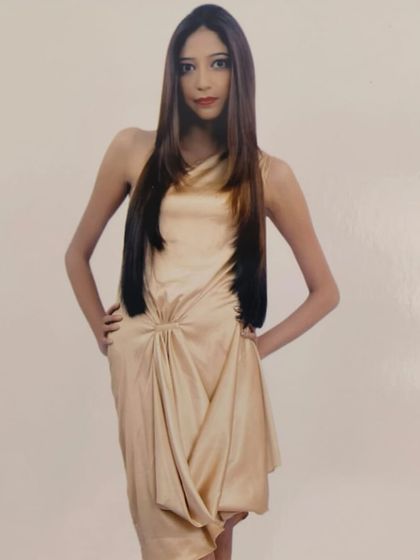 A professional shot of a model with a sleek, modern hairstyle. A sharp cut and expert styling can elevate your everyday look.