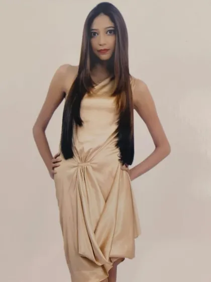 A professional shot of a model with a sleek, modern hairstyle. A sharp cut and expert styling can elevate your everyday look.