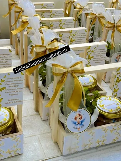 Another view of the beautifully arranged gold and white announcement baskets, ready for delivery to celebrate a new arrival.