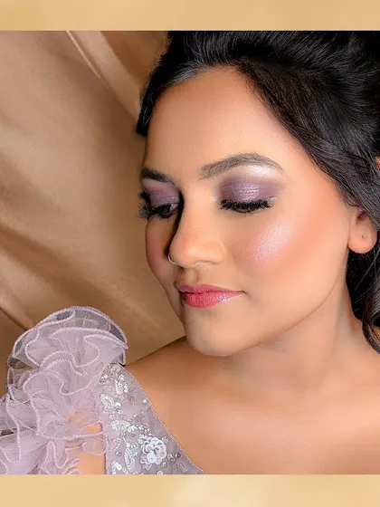 A close-up of the stunning purple eyeshadow for this reception look. The soft shimmer and flawless skin create a look that is both glamorous and elegant.