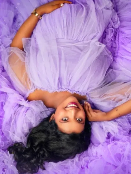 An artistic overhead view of our lavender ruffled gown. This shot shows how the layers of tulle can create a beautiful, flower-like effect around you for a unique pregnancy portrait.