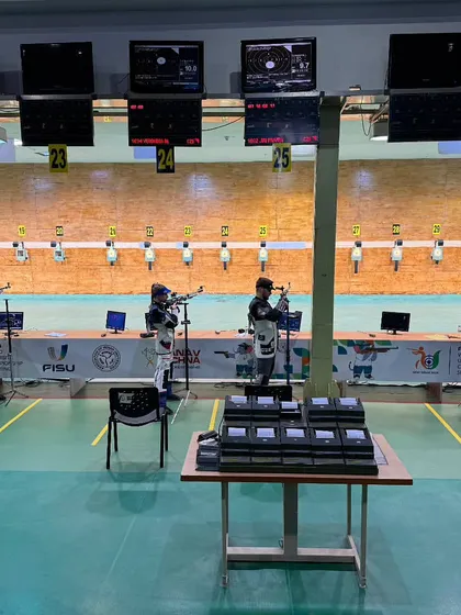 A wide view of the 10M Air Rifle qualification range. We manage the entire competition floor, ensuring a smooth and efficient flow for a large number of international athletes.