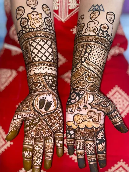This baby shower mehandi is full of cute details, including baby footprints, a sleeping baby, and elephant motifs holding 'Baby Shower' balloons.