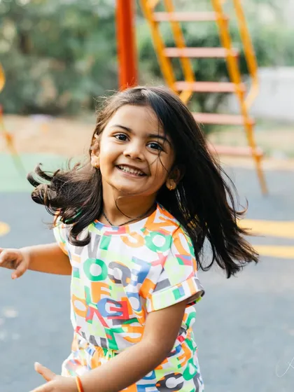 This is my daughter turning four. I love capturing her just as she is, full of energy and running around. Her wild, free spirit is what I aim to capture in every child I photograph.