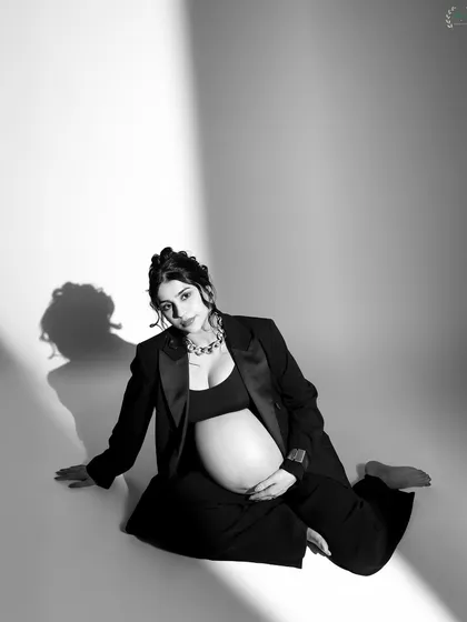 Another angle of Pria's modern maternity look, showing her confidence and grace.