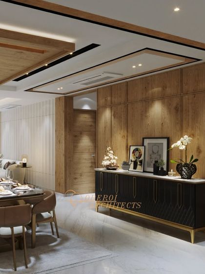 A beautifully lit dining and living space where wood paneling on the walls and ceiling creates a warm and cohesive environment. The black credenza with gold accents adds a touch of modern sophistication.
