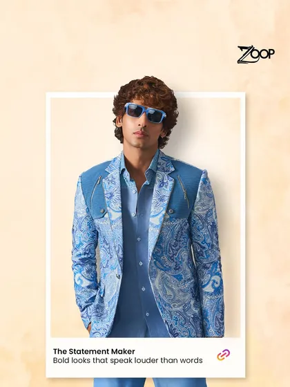 For the man who wants his presence felt, we designed this statement blazer. The bold blue paisley print, combined with structured shoulders and a modern cut, creates a look that speaks volumes. It’s a fusion of traditional motifs and contemporary fashion, perfect for making an entrance.