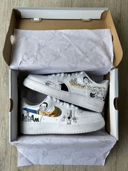 The One Piece manga-style custom sneakers presented in the original Nike box, showcasing the unique unboxing experience.
