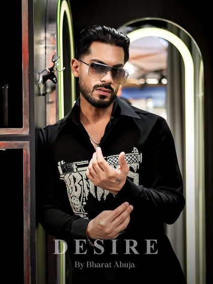 Confidence tailored, attitude stitched. This close-up captures the edgy vibe of the 'BAD BOYS' gun shirt.