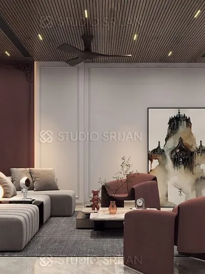 A different view of the Janakpuri living room, showing the comfortable sectional sofa and abstract art, creating a perfect space for family gatherings.