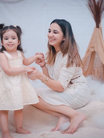Two years of pure joy. A mother and daughter share a dance in our light and airy studio setup.