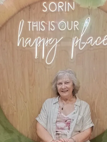 The serene smile of a guest relaxing in our 'Happy Place' chair. This is the feeling of peace I strive to give everyone who walks through my doors.