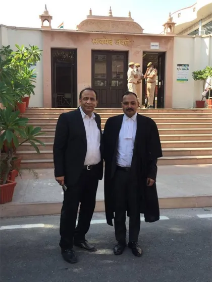 With a colleague outside the Jaipur High Court. Collaboration and professional networks are a vital part of legal practice.