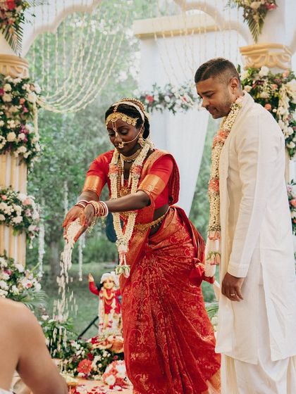 Draping for bride Syama was a beautiful experience. Her traditional red silk saree for her Sanatani wedding ceremony was draped to honour the rituals while ensuring she felt comfortable and radiant.